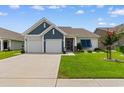 Charming home with a two-car garage and well-manicured front lawn and landscaping at 3185 Viceroy Loop, Little River, SC 29566
