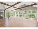 Spacious living room boasting wood beams, hardwood floors and an abundance of large windows at 3597 Sunfish St., Murrells Inlet, SC 29576