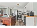 Well-equipped kitchen features stainless steel appliances, butcher block counters, and white cabinets at 3700 Golf Colony Lane # 2-J, Little River, SC 29566