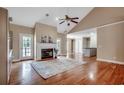 Spacious living room with hardwood flooring, fireplace, and large windows offering ample natural light at 391 William Nobles Rd., Aynor, SC 29511