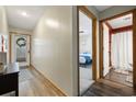 Inviting hallway leading to the bedroom and bathroom, features wood floors and a view of the front door at 4450 Little River Inn Ln. # 601, Little River, SC 29566