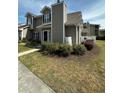 Inviting two-story home featuring verdant landscaping enhancing curb appeal at 503 20Th Ave. N # 3B, North Myrtle Beach, SC 29582