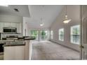 Open-concept space with a kitchen view and a view of a balcony from the living room at 5046 Belleglen Court # 202, Myrtle Beach, SC 29579