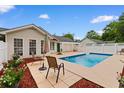 Backyard pool with a patio, seating area and lush landscaping, great for entertaining at 556 Crusade Circle, Conway, SC 29526