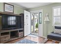 Inviting foyer with wood floors, open doorway, and decorative artwork at 611 2Nd Ave. S # 18-C, North Myrtle Beach, SC 29582