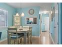 Bright dining room featuring a dining table with 4 chairs and coastal decor at 614 14Th Ave. S # 47, Surfside Beach, SC 29575
