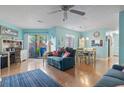 Open living room with dining area and slider door access to private yard at 614 14Th Ave. S # 47, Surfside Beach, SC 29575