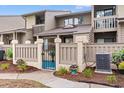 Exterior view of townhome featuring private fenced patio, meticulous landscaping, and a modern AC unit for enhanced comfort at 620 15Th Ave. S # 87, Surfside Beach, SC 29575
