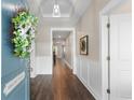 Bright, welcoming foyer with hardwood floors, elegant wainscoting, and stylish decor providing an inviting ambiance at 908 Pelagic Loop, Myrtle Beach, SC 29579