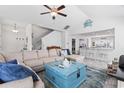 Bright living room featuring vaulted ceiling, comfortable seating, and seamless flow to the kitchen bar at 914 Mary Read Dr., North Myrtle Beach, SC 29582