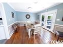 Cozy dining room with hardwood floors and stylish wainscoting at 1150 Waterway Dr., Myrtle Beach, SC 29572