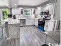 Modern kitchen featuring stainless steel appliances and granite countertops at 1150 Waterway Dr., Myrtle Beach, SC 29572