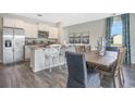 Open-concept kitchen featuring stainless steel appliances, granite counters, and an adjacent dining area at 1429 Nokota Dr., Conway, SC 29526
