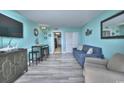 Inviting living room with cozy seating, a flat-screen TV, and stylish decor in a beachy aesthetic at 2000 N Ocean Blvd. # 1209, Myrtle Beach, SC 29577