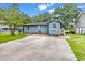 Charming home with a spacious backyard, mature trees, and a large driveway for easy parking at 2196 Liberty Circle, Little River, SC 29566