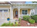 A welcoming covered front porch, beautiful landscaping, and a charming spot to relax and enjoy the outdoors at 2199 Birchwood Circle, Myrtle Beach, SC 29577