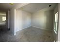 Unfinished living room offers a blank canvas with bright lighting and a view of the property's yard at 3012 Palma Way, Myrtle Beach, SC 29579