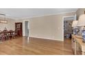 Open-concept space with hardwood floors, neutral walls and views into other living spaces at 312 S Poplar Ave., Andrews, SC 29510