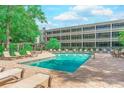 Relaxing pool with lounge chairs, perfect for sunny days and enjoying the beautiful surroundings at 415 Ocean Creek Dr. # 2373, Myrtle Beach, SC 29572