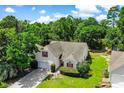 Aerial view of a single Gathering home with a well manicured lawn, landscape, and wooded area at 4570 Fringetree Dr., Murrells Inlet, SC 29576