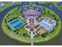 Aerial view of a community clubhouse featuring a pool, tennis courts, and playground at 496 West Palm Dr., Myrtle Beach, SC 29579