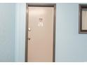 Apartment door at 337 featuring metal door and frame on a light blue hallway wall at 5905 South Kings Hwy. # A337, Myrtle Beach, SC 29575