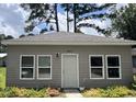 Exterior view of house 613 featuring vinyl siding, new windows, and tasteful landscaping at 613 Todd Blvd., Conway, SC 29526