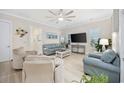 Comfortable living room with ample seating, a large TV, and natural light at 721 Mckinley Way, Myrtle Beach, SC 29577