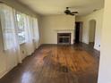 Bright living room featuring hardwood floors and a fireplace at 911 Park Ave., Marion, SC 29571