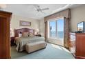 Cozy bedroom with ocean views and comfortable furnishings at 9994 Beach Club Dr. # 1202, Myrtle Beach, SC 29572