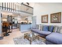 Open-concept living room featuring a modern kitchen, a lofted area, and comfortable seating with stylish decor at 1205 Erin Way # 5C, Myrtle Beach, SC 29577