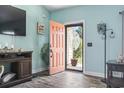Light-filled foyer featuring an orange front door with decorative glass and modern accents at 131 River Country Dr., Conway, SC 29526