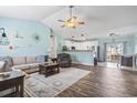 Bright living room showcasing an open concept design with dining area and kitchen in background at 131 River Country Dr., Conway, SC 29526