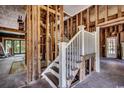 Unfinished staircase with white railings and exposed wooden beams at 1311 9Th Ave., Conway, SC 29526