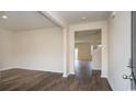 Bright living room featuring stylish wood flooring and an open layout with neutral colors at 3557 Ashridge Way, Conway, SC 29526