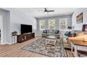 Cozy living room with hardwood floors, ample natural light, comfortable seating, and stylish decor at 520 Cattle Drive Circle, Myrtle Beach, SC 29588