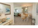 Comfortable living area featuring tiled floors, a dining table, and a stylish sofa, perfect for relaxation and entertainment at 5905 South Kings Hwy. # 1414, Myrtle Beach, SC 29575