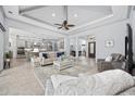 Spacious living room features an open floor plan, ceiling fan, and seamless flow to the kitchen at 7961 San Marcello Dr., Myrtle Beach, SC 29579
