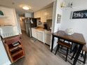 Efficient kitchen with modern appliances, a dining area, and stylish decor at 920 N Waccamaw Dr. # 2206, Garden City Beach, SC 29576