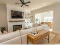 Comfortable living area featuring a fireplace, built-in shelving, and seamless access to the dining area at Simpson Creek Dr., Loris, SC 29569