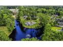 Secluded home surrounded by lush greenery and a tranquil pond with a fountain, creating a private oasis at 1028 Colette Ct, Conway, SC 29526