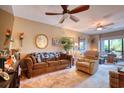 Living room with ceiling fans, comfortable seating and an area for dining at 1102 Indian Wells Ct. # 2, Garden City Beach, SC 29576