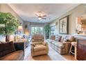 Living room with a lot of natural lighting and comfortable seating at 1102 Indian Wells Ct. # 2, Garden City Beach, SC 29576