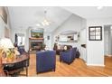 Bright living room featuring a fireplace with stone surround and modern furnishings at 174 Edward Ave., Murrells Inlet, SC 29576