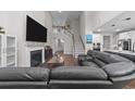 Cozy living room with a fireplace, large TV, and open to the kitchen at 2212 Leeboard Ct., Myrtle Beach, SC 29579