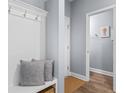 Well-organized entryway with built-in storage and a glimpse into the home's interior, creating a welcoming first impression at 226 Calhoun Falls Dr., Myrtle Beach, SC 29579