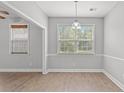 Cozy dining room with neutral color palette, natural light, and luxury vinyl plank flooring at 307 Russ Rd., Loris, SC 29569