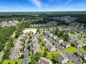 Expansive aerial view of a residential community showcasing well-maintained homes, lush greenery, and organized street layouts at 314 Black Oak Ln. # 102, Murrells Inlet, SC 29576