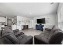 Spacious living room featuring neutral walls, recessed lighting, and contemporary wood-look floors at 417 Spruce Pine Way, Conway, SC 29526