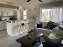 Open concept living area featuring an eat-in kitchen, ample seating, and natural light at 4840 Moss Creek Loop # 31, Murrells Inlet, SC 29576